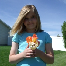 Yvonne's youngest granddaughter, with decapitated tulips from our yard.